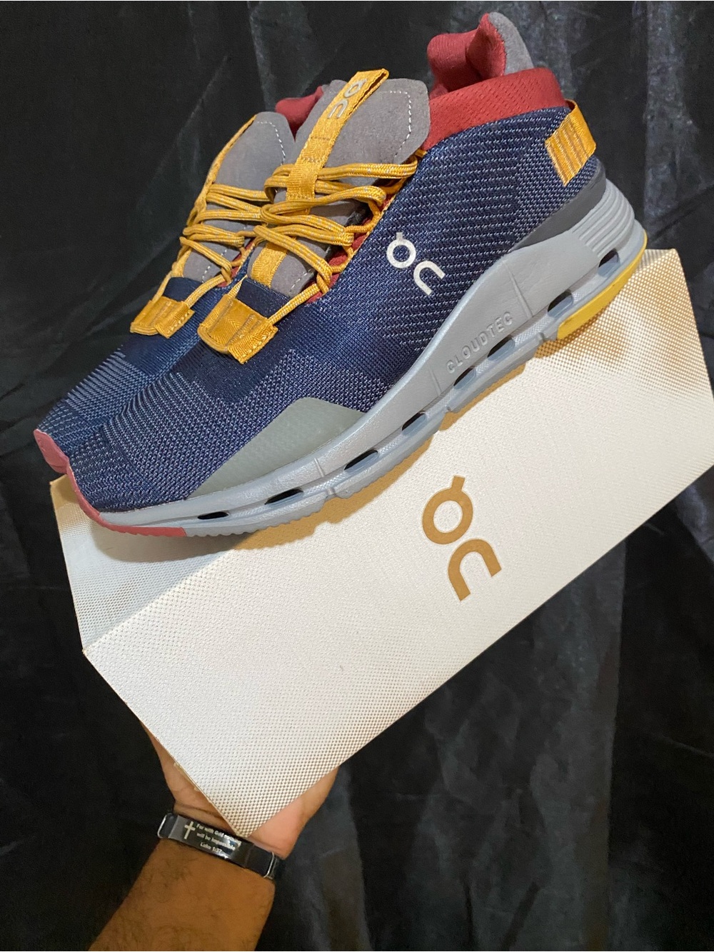 On Running woman’s Navy Sneakers with Yellow Laces & Red Collar